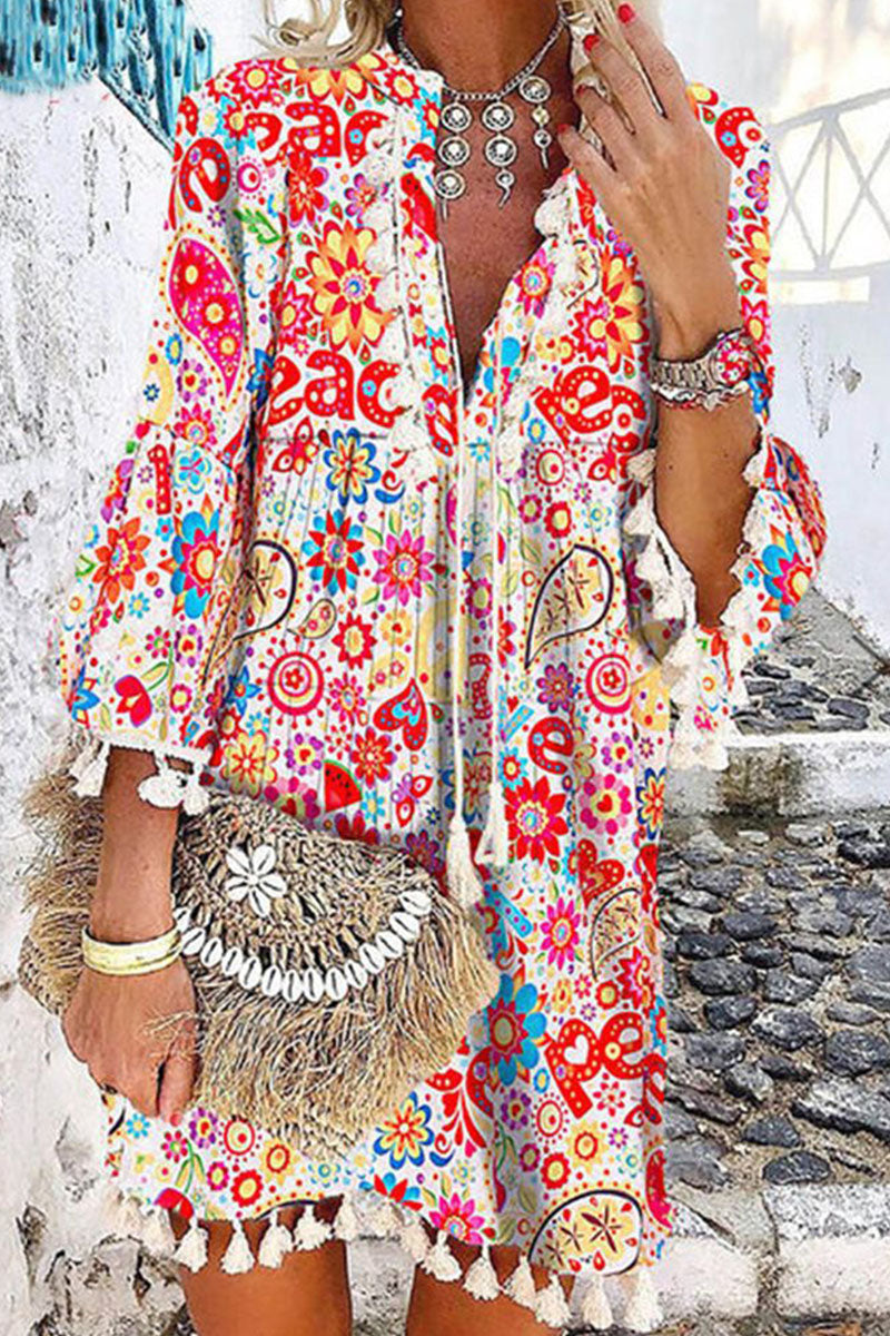 Women's Bohemian Floral Mini Dress with Tassel Hem and Tie Neckline